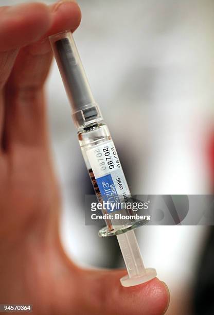 Nicky Healey, a nurse at a Boots pharmacy, displays a vial of CSL Ltd.'s Enzira seasonal flu vaccine in Holborn, London, U.K., on Thursday, Nov. 8,...