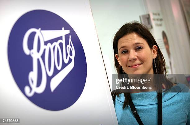 Clare Smith poses after receiving CSL Ltd.'s Enzira seasonal flu vaccine at a Boots pharmacy in Holborn, London, U.K., on Thursday, Nov. 8, 2007....