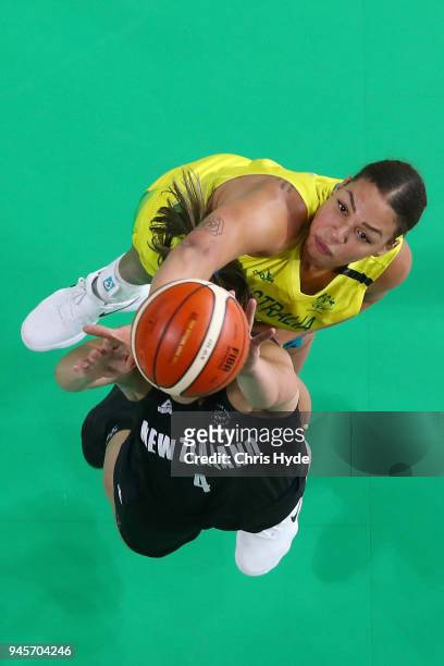 Liz Cambage of Australia and Kalani Puurcell of New Zealand compete for the ball during the Women's Semifinal Basketball match between Australia and...