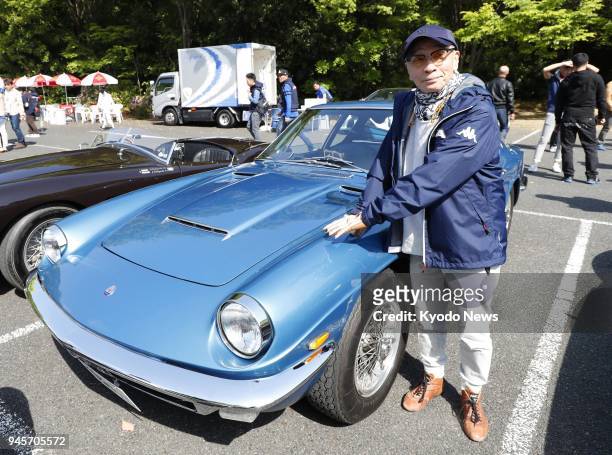 Japanese TV personality Masaaki Sakai poses at Atsuta Shrine in Nagoya on April 13, 2018 before taking part in the annual classic car rally La Festa...