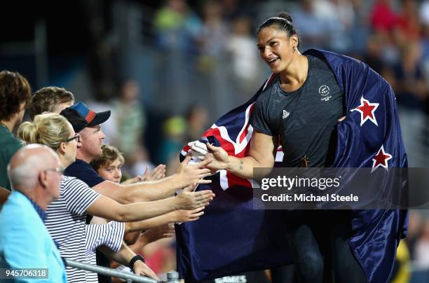 Silver medalist Dame Valerie Adams of New Zealand celebrates with fans after the Women's Shot Put final during athletics on day nine of the Gold...