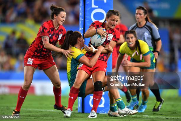 Jasmine Joyce of Wales is tackled by Charlotte Caslick of Australia during the Rugby Sevens Women's Pool B match between Australia and Wales on day...