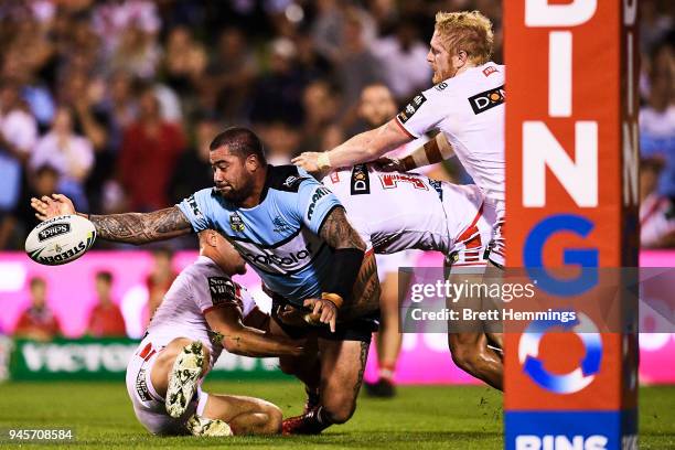 Andrew Fafita of the Sharks offloads the ball during the round six NRL match between the St George Illawarra Dragons and the Cronulla Sharks at WIN...