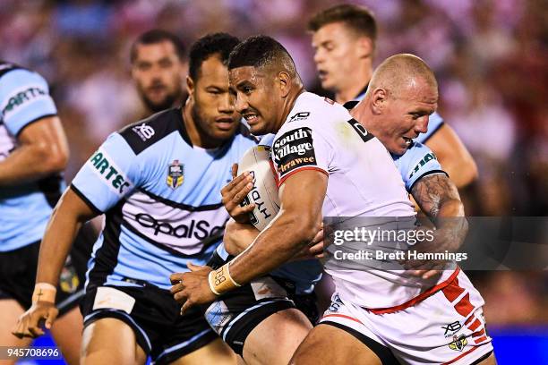 Nene MacDonald of the Dragons is tackled during the round six NRL match between the St George Illawarra Dragons and the Cronulla Sharks at WIN...