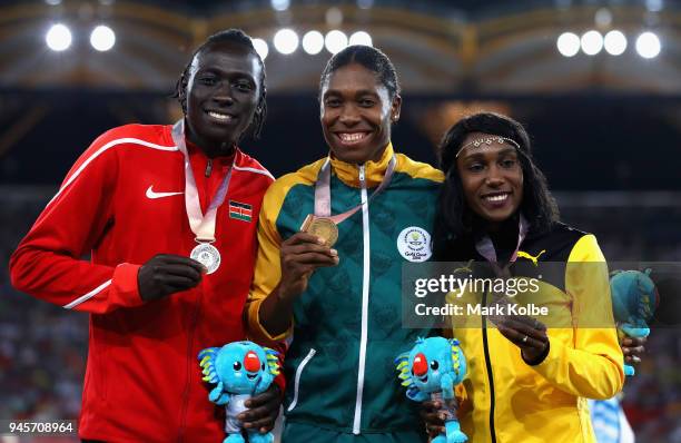 Silver medalist Margaret Nyairera Wambui of Kenya, gold medalist Caster Semenya of South Africa and bronze medalist Natoya Goule of Jamaica pose...