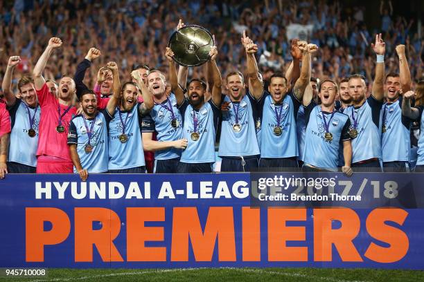 Alex Brosque of Sydney lifts the Premiers Plate during the round 27 A-League match between Sydney FC and the Melbourne Victory at Allianz Stadium on...