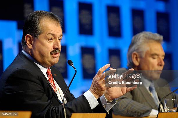 Andrew N. Liveris, chairman and chief executive officer of Dow Chemical Co., speaks as Peter Brabeck-Letmathe, chairman and chief executive officer...