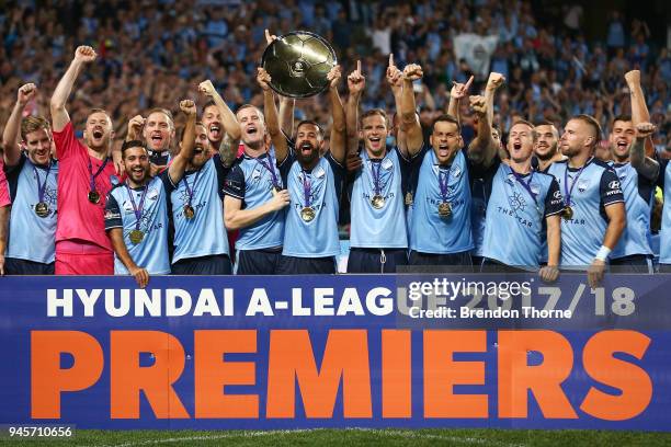 Alex Brosque of Sydney lifts the Premiers Plate during the round 27 A-League match between Sydney FC and the Melbourne Victory at Allianz Stadium on...