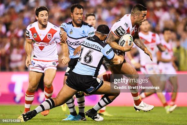 Paul Vaughan of the Dragons is tackled during the round six NRL match between the St George Illawarra Dragons and the Cronulla Sharks at WIN Stadium...