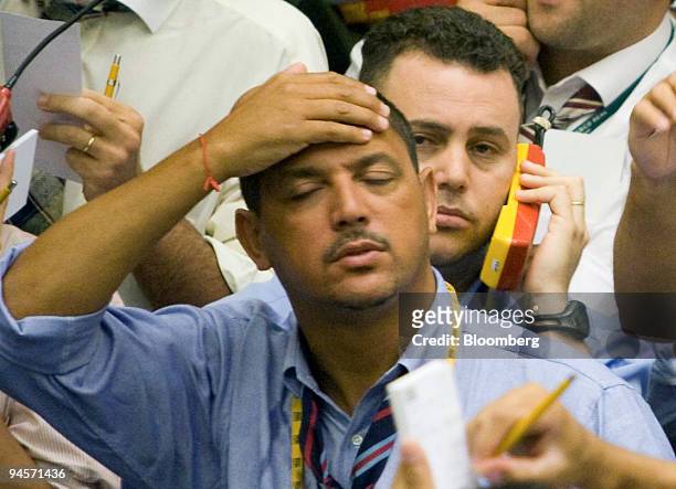 Trader gestures on the floor at the Brazilian Bolsa de Mercadorias e Futuros, or Brazilian Mercantile and Futures Exchange , in Sao Paulo, Brazil, on...
