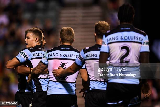 Ricky Leutele of the Sharks celebrates scoring a try with team mates during the round six NRL match between the St George Illawarra Dragons and the...