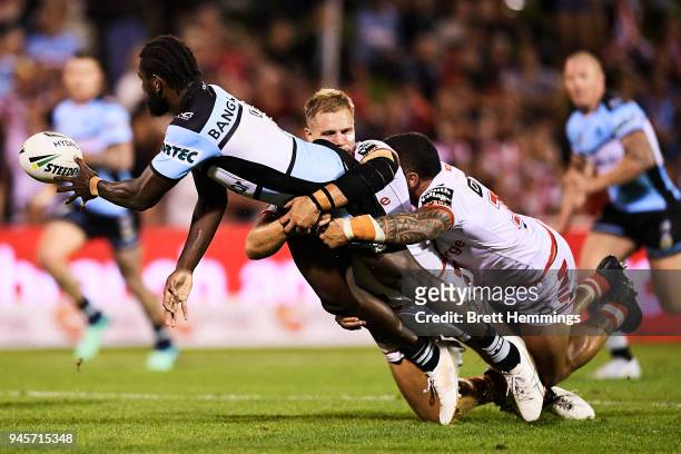 Edrick Lee of the Sharks offloads the ball during the round six NRL match between the St George Illawarra Dragons and the Cronulla Sharks at WIN...