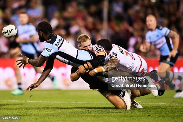 Edrick Lee of the Sharks offloads the ball during the round six NRL match between the St George Illawarra Dragons and the Cronulla Sharks at WIN...