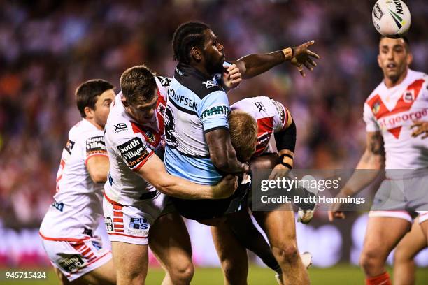 Edrick Lee of the Sharks offloads the ball during the round six NRL match between the St George Illawarra Dragons and the Cronulla Sharks at WIN...