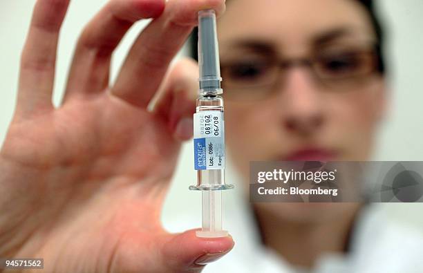 Nicky Healey, a nurse at a Boots pharmacy, displays a vial of CSL Ltd.'s Enzira seasonal flu vaccine in Holborn, London, U.K., on Thursday, Nov. 8,...