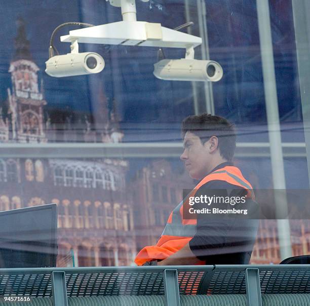 Construction worker sits in the departure lounge at the new Eurostar international train station, which is due to open later this month, in...
