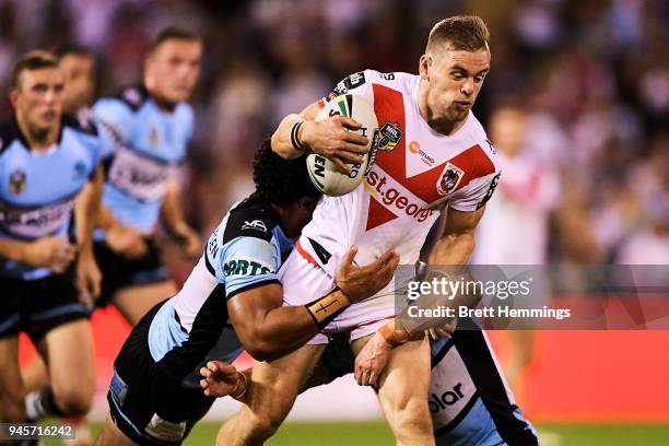 Matthew Dufty of the Dragons is tackled during the round six NRL match between the St George Illawarra Dragons and the Cronulla Sharks at WIN Stadium...