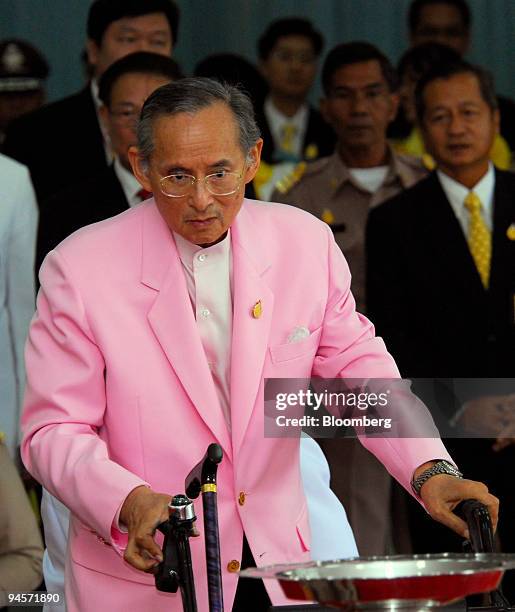 Bhumibol Adulyadej, the King of Thailand, uses a walker as he leaves a hospital in Bangkok, Thailand, on Wednesday, Nov. 7, 2007. King Bhumibol was...