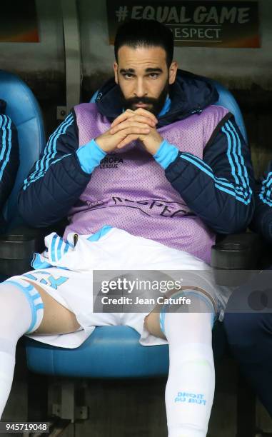 Adil Rami of OM seating on the bench during the UEFA Europa League quarter final leg two match between Olympique de Marseille and RB Leipzig at...