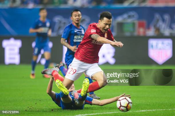 Gao Lin of Guangzhou Evergrande falls down during the 2018 Chinese Super League 6th round match between Shanghai Shenhua and Guangzhou Evergrande at...