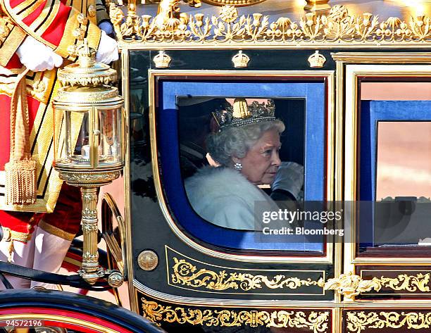 Britain's Queen Elizabeth II, accompanied by the Duke of Edinburgh, travels by state coach for the State Opening of Parliament in London, U.K., on...