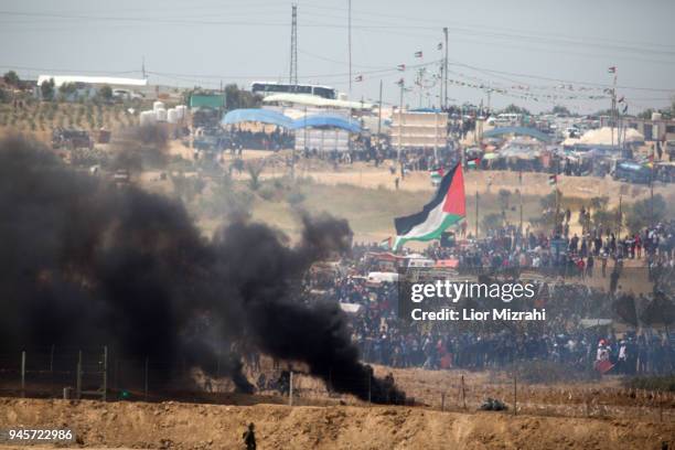 Palestinians gathered for a protest on the Israel-Gaza border on April 13, 2018 in Netivot, Israel. Thousands of Gaza residents assembled on Friday...