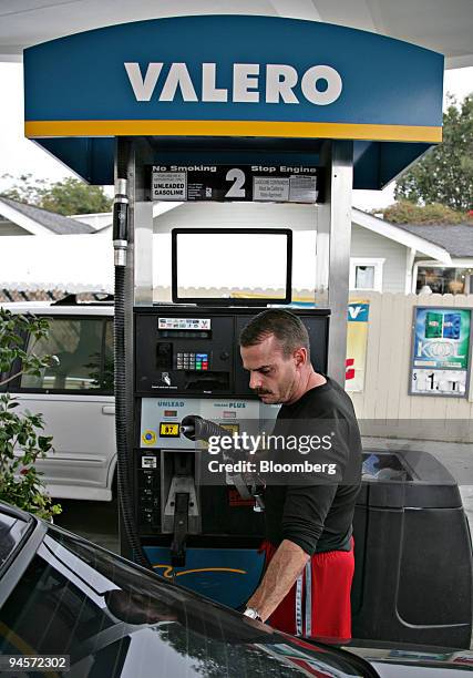 Patrick Wright prepares to pump gasoline into his car at a Valero station in Long Beach, California, Tuesday, Nov. 6, 2007 Valero Energy Corp., the...