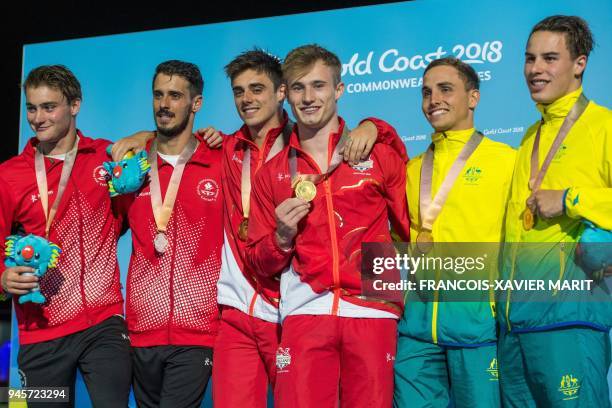 Silver medallist Canada's Philippe Gagne and Canada's François Imbeau-Dulac , gold medallists England's Jack Laugher and England's Chris Mears and...
