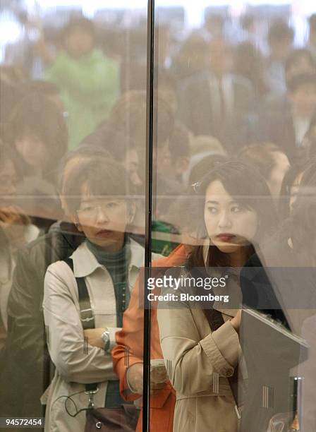 Shoppers wait for the opening of J. Front Retailing Co. 's Daimaru department store in the GranTokyo towers in Tokyo, Japan, on Tuesday, Nov. 6,...
