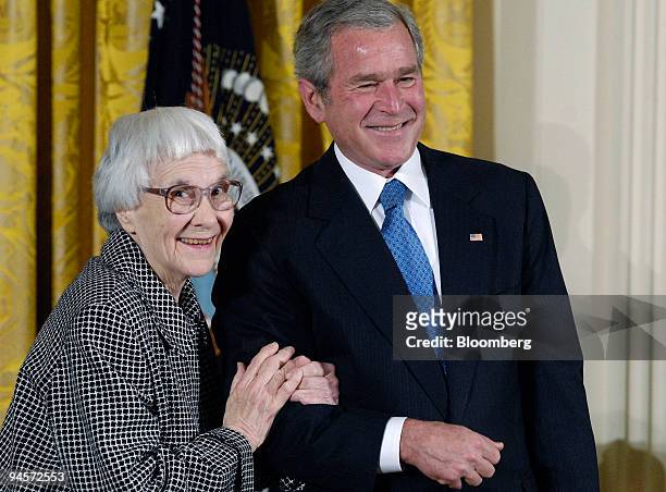 Harper Lee, left, the author of "To Kill a Mockingbird," receives the Presidential Medal of Freedom from U.S. President George W. Bush, right, during...