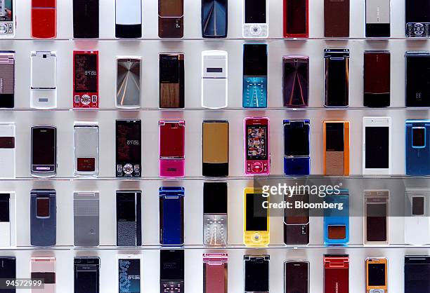 DoCoMo Inc.'s new range of mobile phones are displayed during a product launch event in Tokyo, Japan, on Thursday, Nov. 1, 2007. NTT DoCoMo Inc.,...