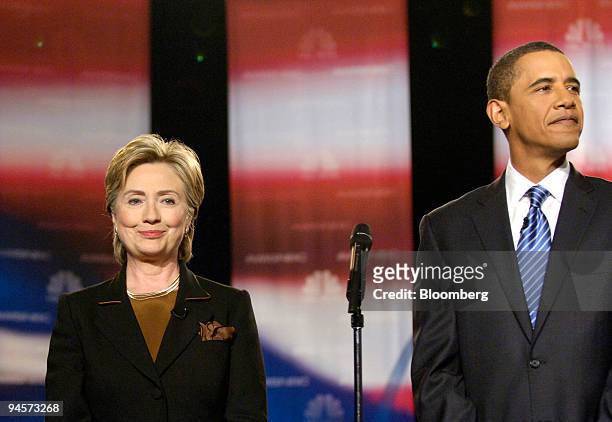 Hillary Clinton, left, senator from New York, and Barack Obama, senator from Illinois, gather prior to a debate among Democratic Party presidential...