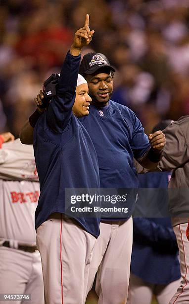 Manny Ramirez, left, and David Ortiz of the Boston Red Sox celebrate after their team defeated the Colorado Rockies in Game 4 of the Major League...