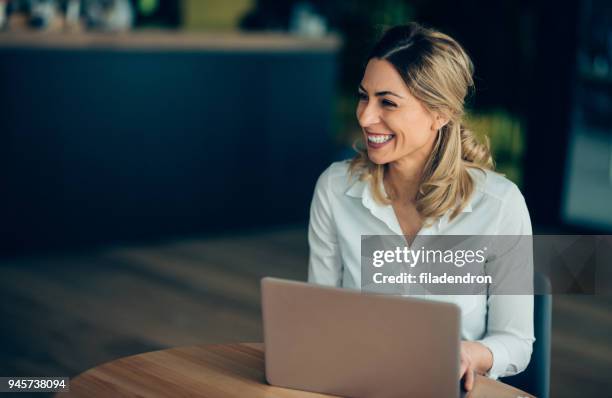 smiling business woman working - preppy stock pictures, royalty-free photos & images