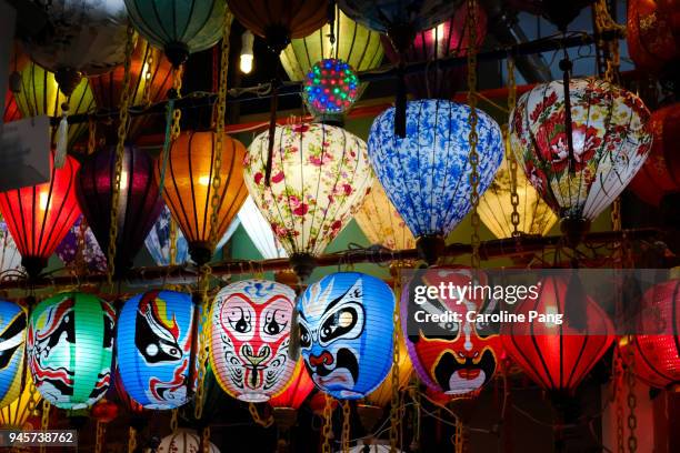 oriental masks and lanterns. - caroline pang stock pictures, royalty-free photos & images