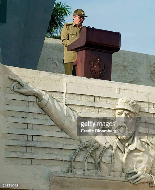 Cuba's interim President Raul Castro gives a speech at the Revolution Square in Camaguey, 375 miles east of Havana, Cuba, next to a bas-relief of...
