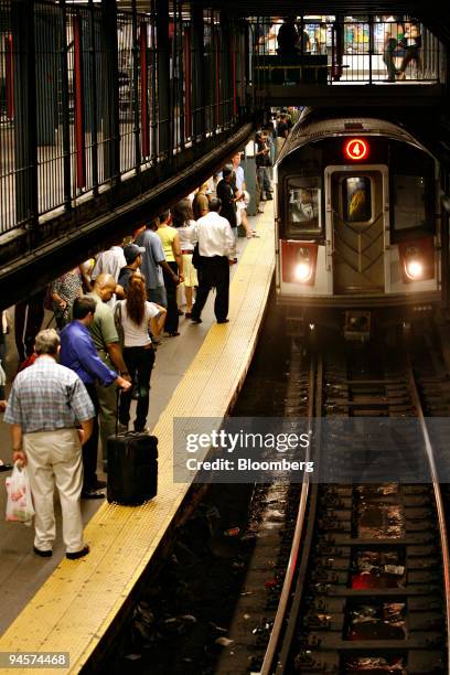 Passengers wait for an arriving 4 train in the Union Square subway station, Wednesday, July 25, 2007 in New York. New York's Metropolitan...