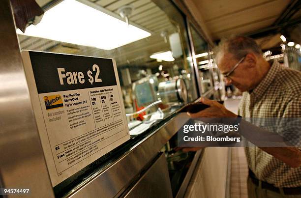 Joseph Wagner purchases a single ride ticket, Wednesday, July 25 in the Herald Square subway station in New York. New York's Metropolitan...