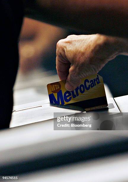 Subway rider swipes her Metro Card, Wednesday, July 25 in the Herald Square subway station in New York. New York's Metropolitan Transportation...