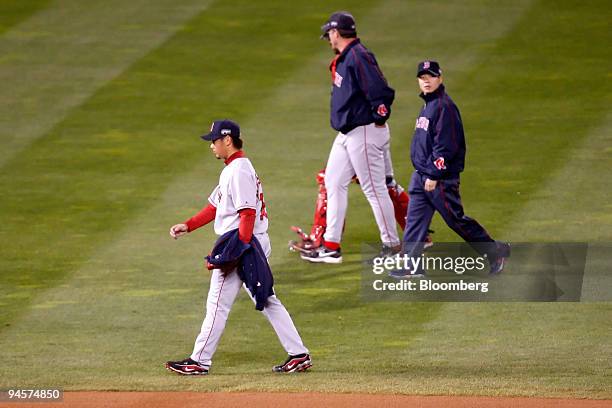Daisuke Matsuzaka of the Boston Red Sox, left, walks onto the field before pitching against the Colorado Rockies in Game 3 of the Major League...