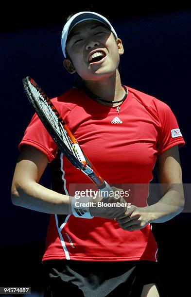 Aiko Nakamura of Japan reacts after losing her match against Justine Henin of Belgium on day one of the Australian Open tennis tournament in...