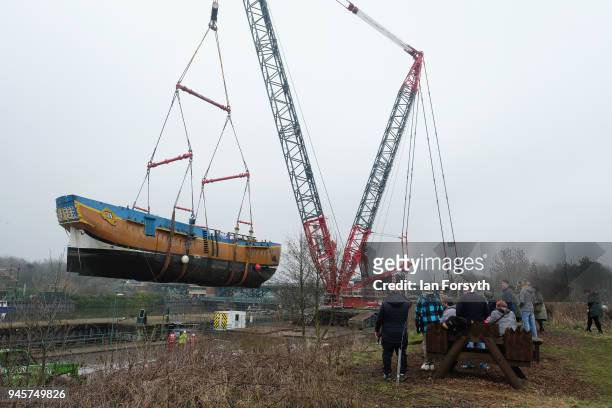 Replica of Captain Cook's famous ship, HM Bark Endeavour, is hoisted by crane over the lock gates on the River Tees barrage as it undergoes...