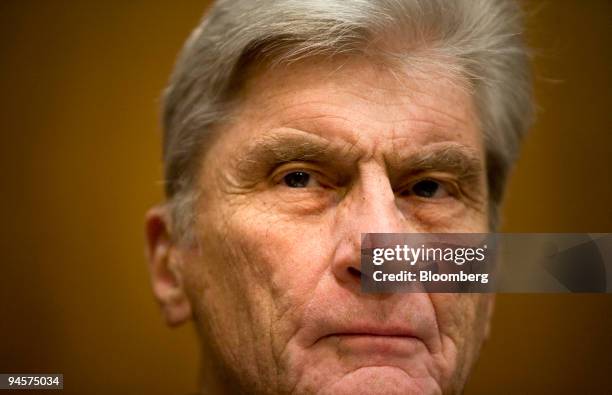 Senator John Warner, a Republican from Virginia, listens during a hearing of the Senate Subcommittee on Private Sector and Consumer Solutions to...