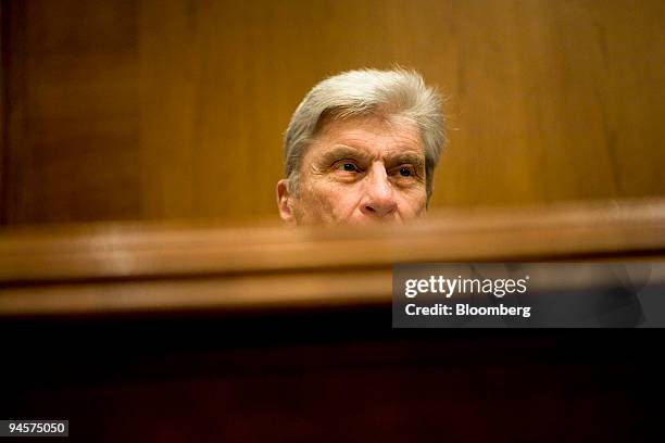 Senator John Warner, a Republican from Virginia, listens during a hearing of the Senate Subcommittee on Private Sector and Consumer Solutions to...