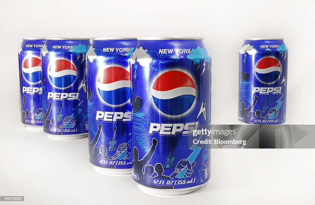 Pepsi cans are arranged for display in New York, July 24, 20