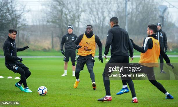 Ayoze Perez passes the ball in a game of possession whilst Massadio Haidara runs to intercept the pass during the Newcastle United Training Session...