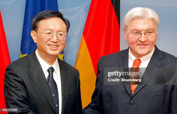 Yang Jiechi, China's foreign minister, left, poses with Frank-Walter Steinmeier, Germany's foreign minister, at the Foreign Ministry in Berlin,...