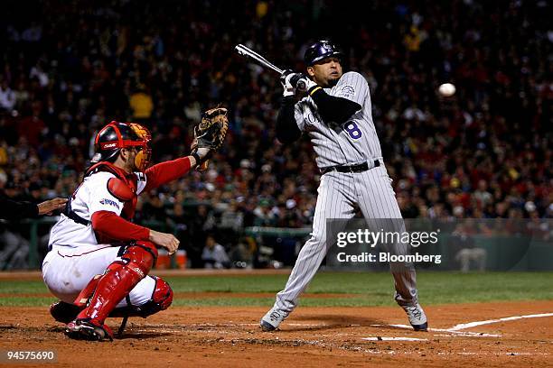 Yorvit Torrealba of the Colorado Rockies avoids a pitch by Curt Schilling of the Boston Red Sox during Game 2 of the Major League Baseball World...