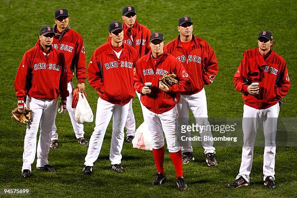Members of the Boston Red Sox pitching staff stand on the field after warm-ups before Game 2 of the Major League Baseball World Series against the...