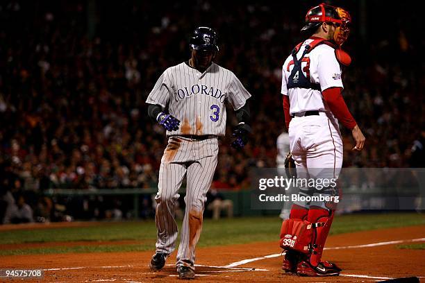 Willy Taveras of the Colorado Rockies, No. 3, scores off of Curt Schilling of the Boston Red Sox during Game 2 of the Major League Baseball World...